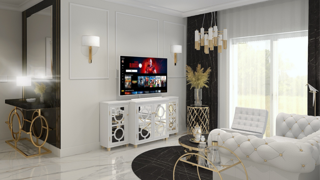 Elegancka aranżacja ściany za telewizorem z białymi i złotymi akcentami w stylu glamour