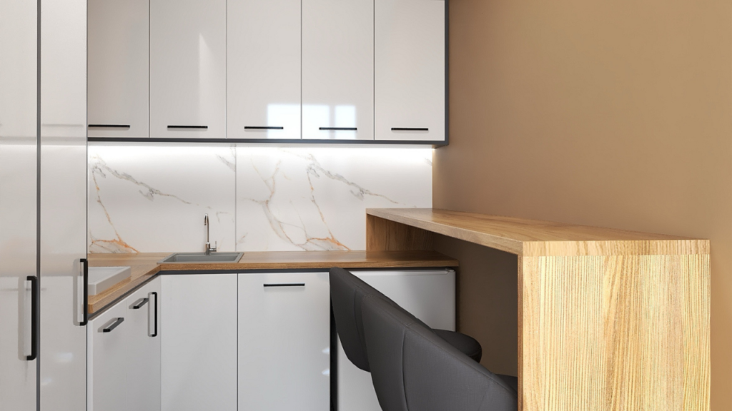 Minimalistyczne, jasne szafki na  wysoki połysk optycznie powiększą przestrzeń