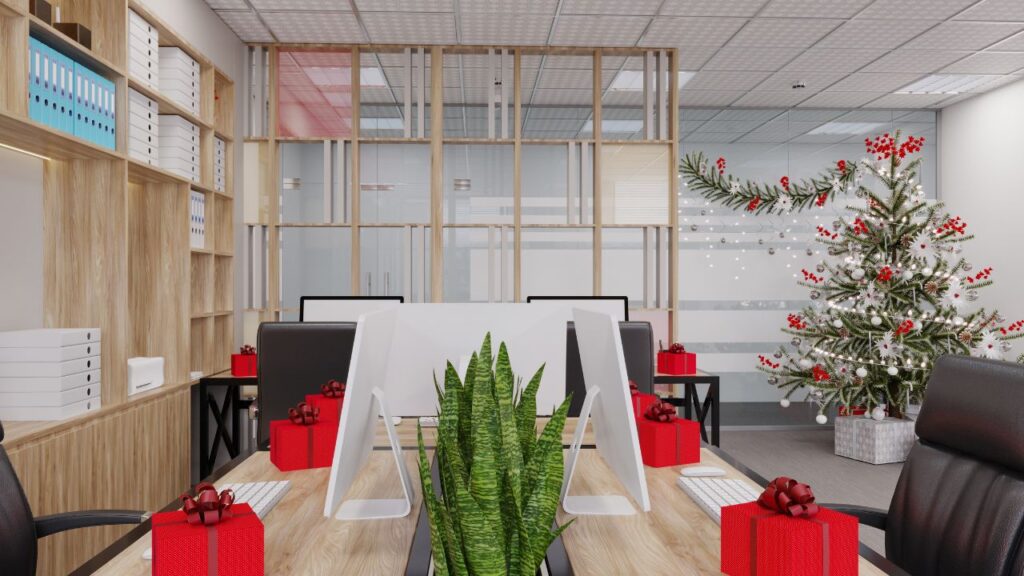 Świąteczna aranżacja biura z dużą sztuczną choinką i ciepłym oświetleniem