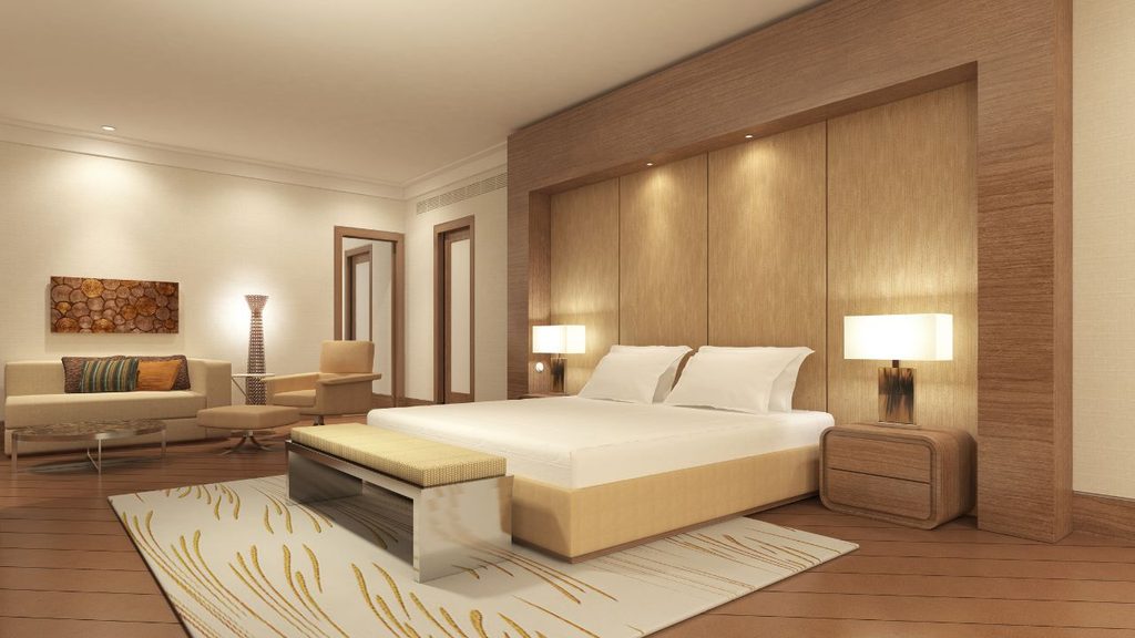 Funkcjonalny pokój hotelowy zaprojektowany z myślą o komforcie gościa i trwałości wyposażenia.